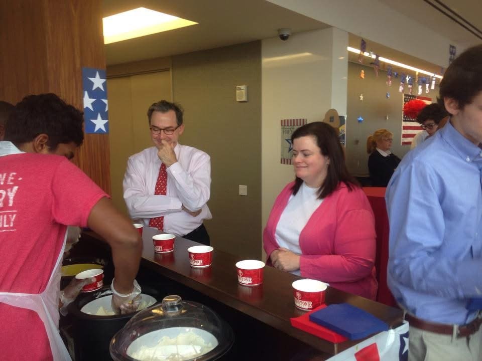 Guests being served Cold Stone ice cream at an indoor event