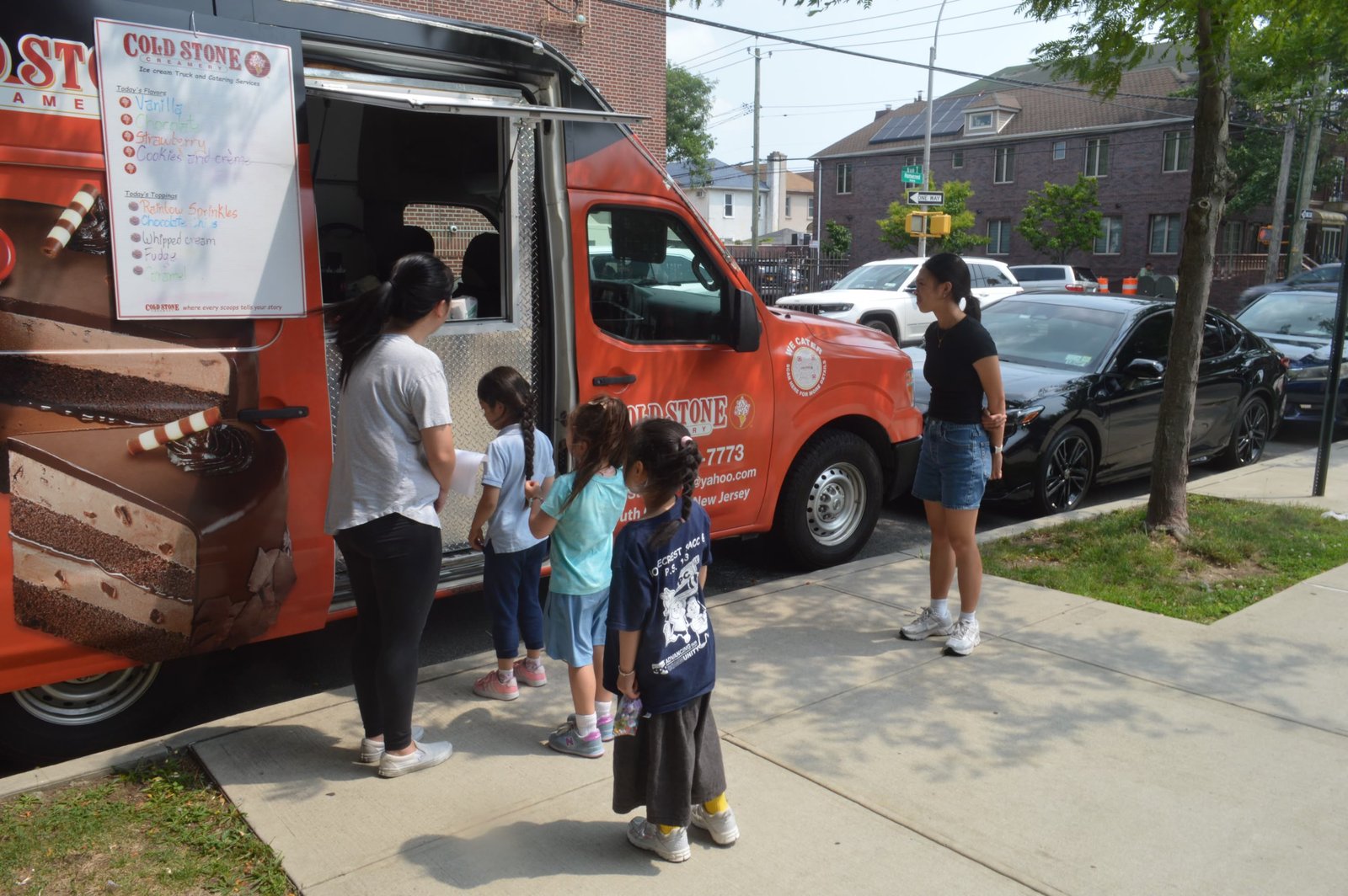 The Cold Stone ice cream truck serving guests at a neighborhood event